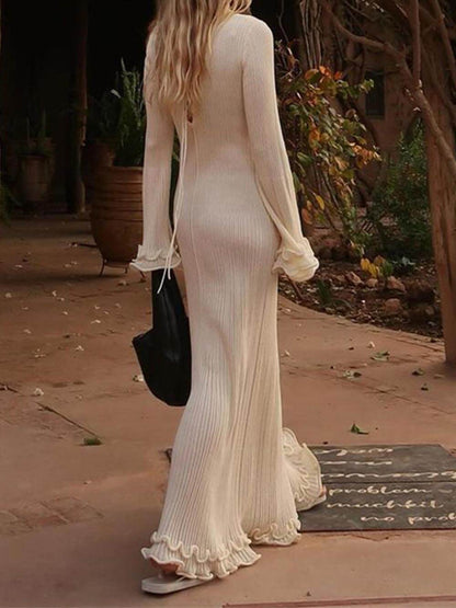 Robe maxi élégante à manches trompette, ourlet roulé et col rond en maille