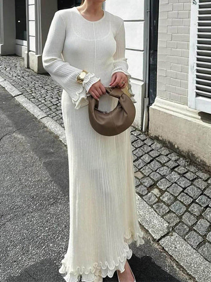 Robe maxi élégante à manches trompette, ourlet roulé et col rond en maille